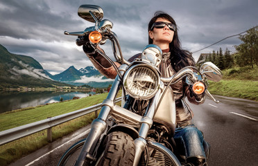 Wall Mural - Biker girl on a motorcycle