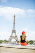 © rh2010 - Woman in red enjoying great view on the Eiffel tower in Paris