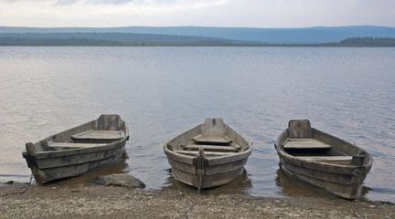 Naklejka na meble old fishing wooden boat on the lake