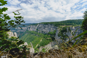 Impressive views of the European mountains with white clouds and blue skies