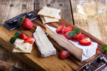 Wall Mural - Brie cheese with fresh strawberries and mint