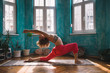 © Mosuno/Stocksy - Woman Doing Yoga in a Living Room