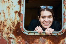 Attractive Young Woman Looking Out Of The Window Metal Caboose.