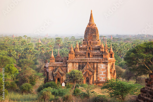 Sunrise with old temple and green lanscape, Bagan, Myanmar Poster