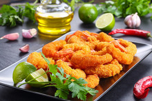 fried breaded shrimps on plate, close-up