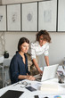 © Drobot Dean - Vertical image of two young women are discussing something