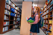 © LIGHTFIELD STUDIOS - redhead schoolgirl in library