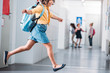 © LIGHTFIELD STUDIOS - schoolgirl running through school corridor