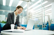 © pressmaster - Young businesswoman preparing her working plan or looking for ideas for new project in the net