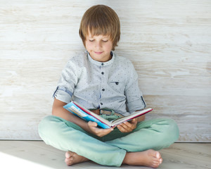 Wall Mural - A child with a book 