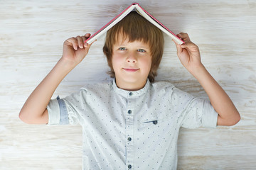 Wall Mural - A child with a book 