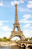 Fototapeta Boho - View on the famous Eiffel tower on the blue sky background in Paris
