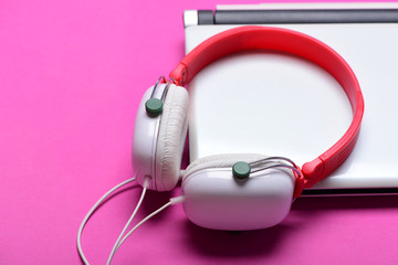 Earphones in red and white colors with silver computer