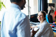 © BONNINSTUDIO/Stocksy - Young entrepreneurs talking in a modern creative office.