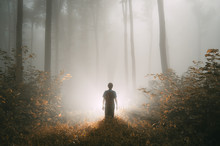 Man With Strange Magical Light In Autumn Forest