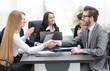 © ASDF - handshake between a businesswoman and a businessman