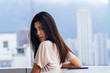 © Christian McLeod Photography/Stocksy - Young girl in Hong Kong caught enjoying the view from a rooftop