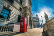 Big ben on the background and red telephone booth in London at sunrise