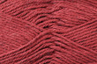 © Vitoria Holdings LLC - A super close up image of maroon yarn