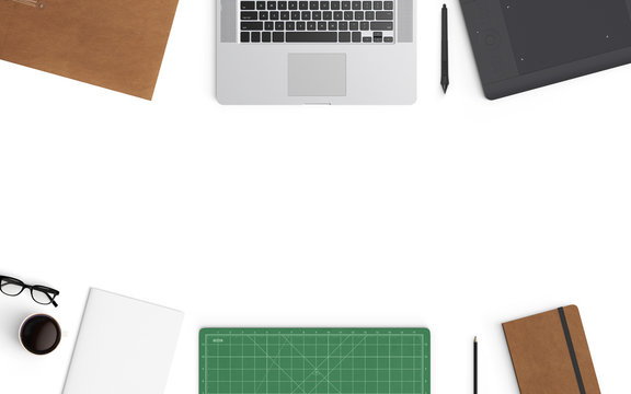 Modern workspace with laptop, coffee cup, cutting mat, and graphic tablet copy space on color background. Top view. Flat lay style.