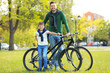 © Africa Studio - Dad and son standing with their bicycles outdoors
