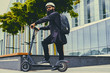 © Fxquadro - A man posing on electric scooter.