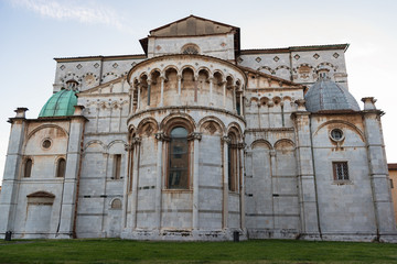 Wall Mural - Romanesque Facade and bell tower of St. Martin Cathedral in Lucca, Tuscany. It contains most precious relic in Lucca, Holy Face of Lucca (Italian: Volto Santo di Lucca)