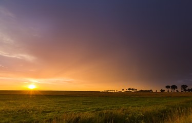 Beautiful sunset sky over meadows