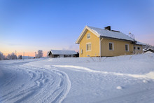 House In The Village In Winter