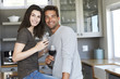 © sanneberg - Handsome kitchen couple posing for camera, portrait