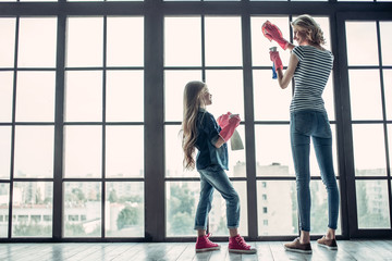 Wall Mural - Mom with daughter doing cleaning