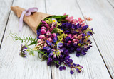 Fototapeta Lawenda - Lupine flowers on a  table