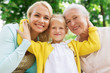 © Syda Productions - woman with daughter and senior mother at park