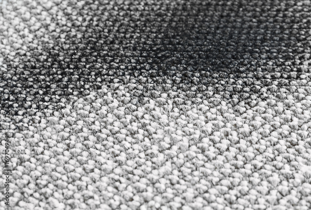 Spot of soil on light carpet