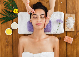 woman massagist make face lifting massage in spa wellness center