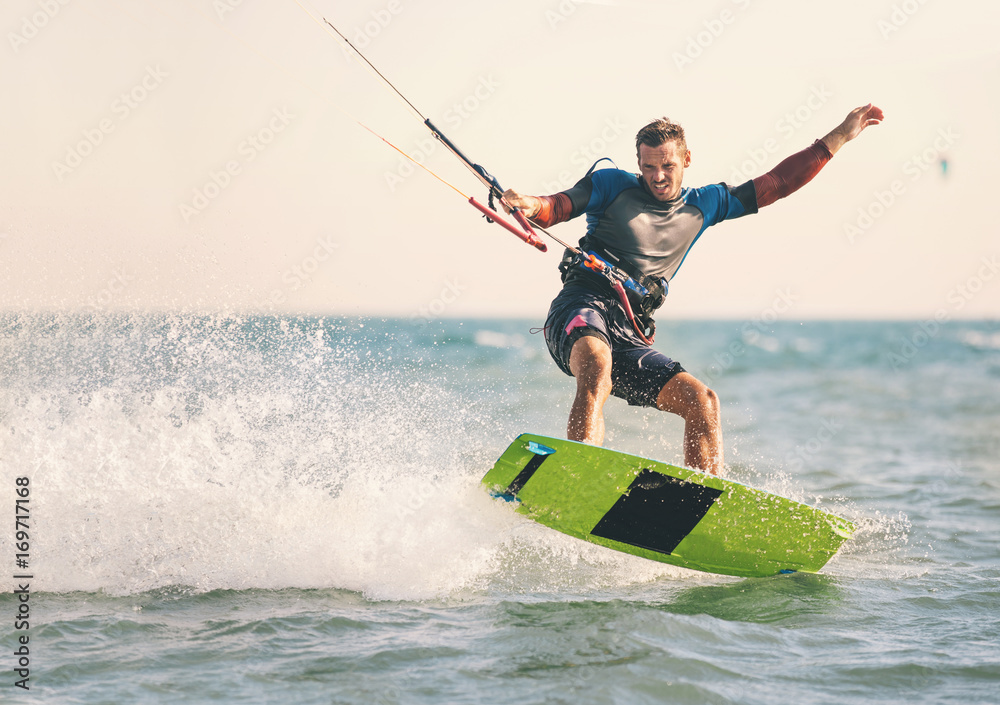 Kitesurfing, Kiteboarding action photos, man among waves quickly goes - obrazy, fototapety, plakaty 