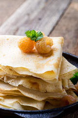 Canvas Print - Homemade  crepes served with fresh yelllow raspberries