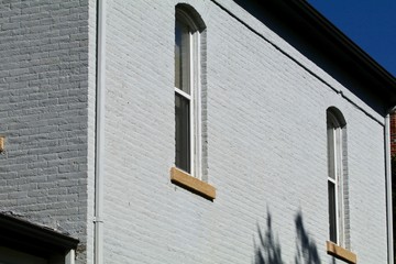 Nineteenth century round top windows in old brick house