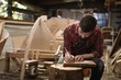 © Wavebreak Media - Carpenter working in workshop