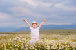 © Inna Darda - Happy boy on the field of chamomiles