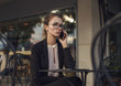 © xo4uphoto - Serious business woman in suit talking on the cellphone