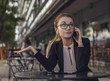 © xo4uphoto - Business woman or teacher talking on the cellphone emotionally