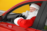 Fototapeta Kuchnia - Authentic Santa Claus driving his red car, outdoors