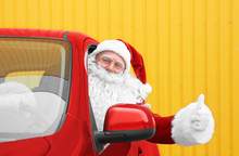 Authentic Santa Claus In Car Showing Thumb Up Gesture