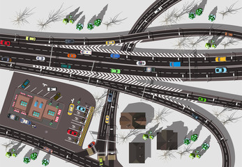 large high-speed interchange of the highway with a store and a crossroads top view winter white snow