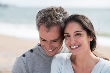 Canvas Print - Portrait of a middle-aged couple having fun on the beach