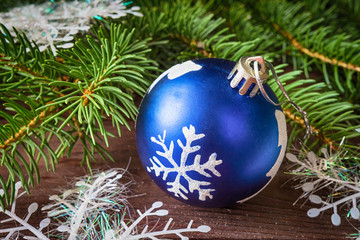 Christmas Christmas decorations blue ball and fir branches on a dark background with copy space