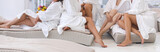 Group of woman in robes Womens legs in the spa
