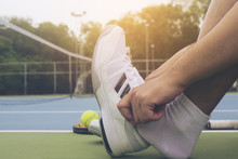 Tennis Player Is Putting Shoe Before The Match In Tennis Hard Court