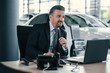 © Nejron Photo - Top sales manager at dealership showroom